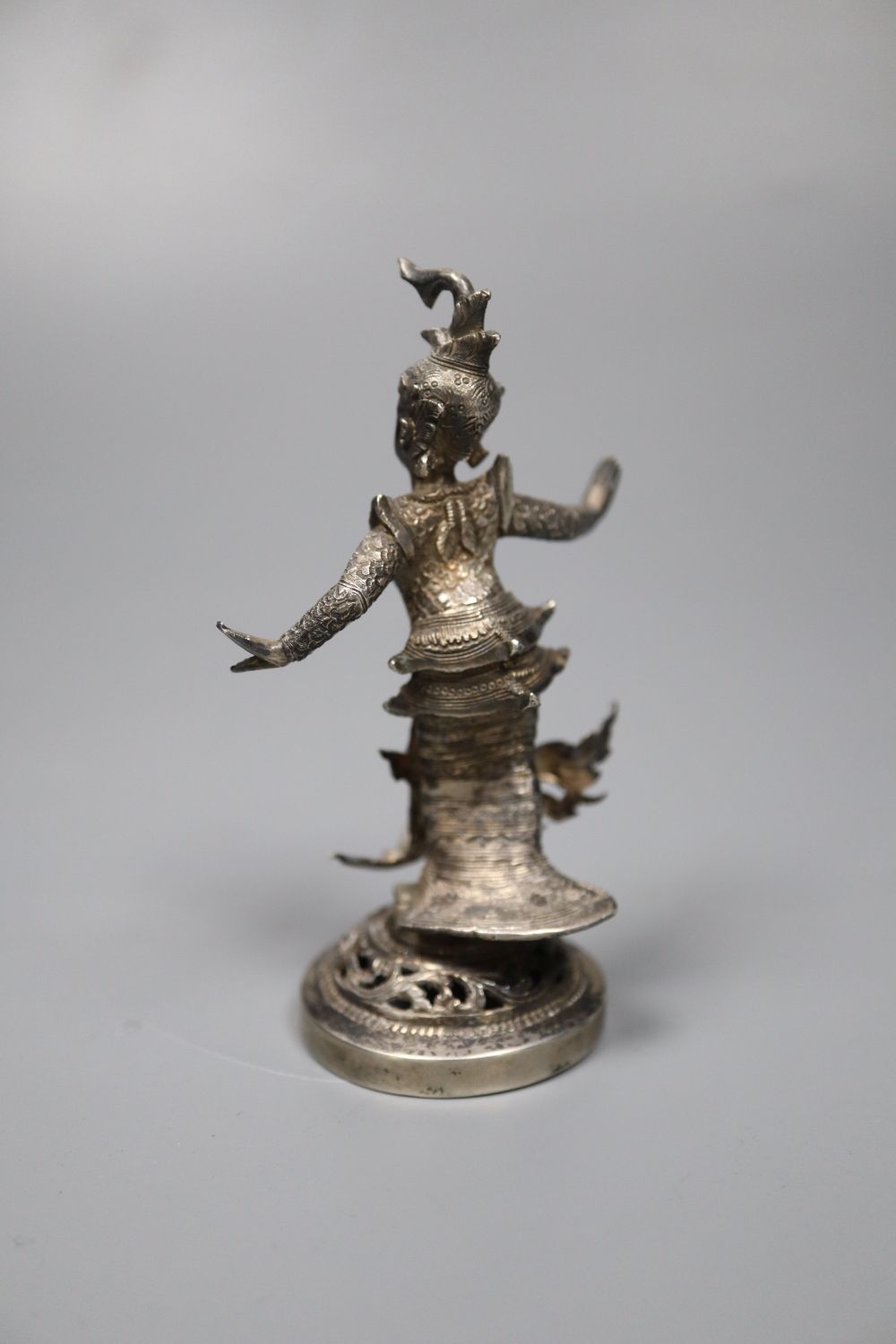 A small Burmese white metal figural table decoration, 9cm, 88 grams.